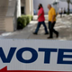 A sign points to the early-voting station set up at a Miami government building Oct. 28, 2014.
Joe Raedle/Getty Images